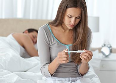 Girl looks at a pregnancy test