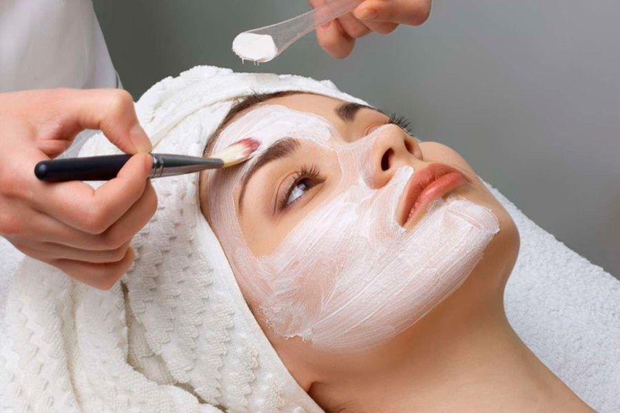 Chemical peeling is done to a girl in the salon