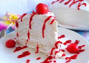 Pancake cake with sour cream and berry syrup