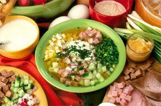 Plate of okroshka surrounded by products
