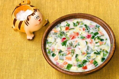 Top view on a plate with okroshka on the water