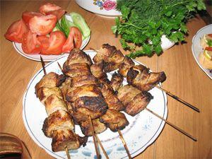 Homemade barbecue on a table with vegetables