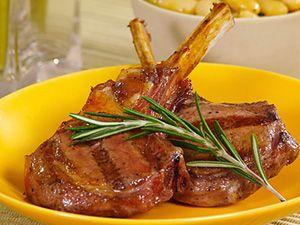Baked lamb ribs on a yellow plate