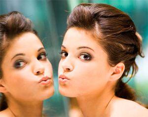 Girl's face and reflection in the mirror