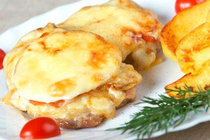 Serving of french meat on a plate with greens