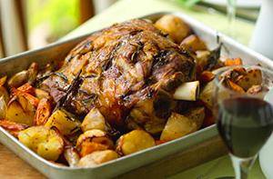 Lamb on a baking sheet with potatoes