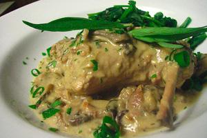 Rabbit with mushrooms in sour cream sauce