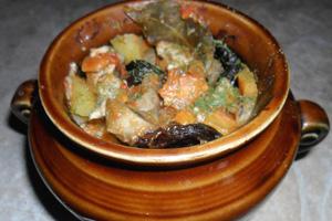 Chicken in a pot with mushrooms and potatoes