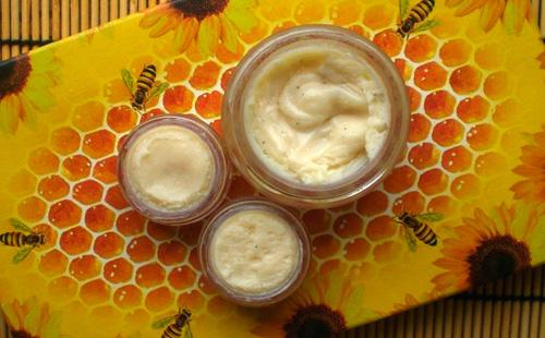 Honey mask in jars on the background of a tablecloth with bees