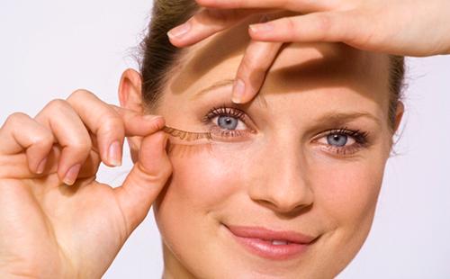 Girl laughs and tries on new cilia