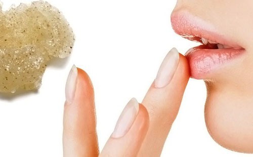 Girl smears lips with cream