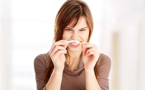 Girl breaks a cigarette
