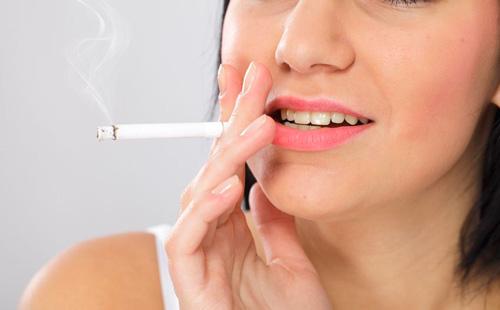 Girl smokes a cigarette