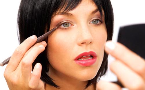 Business woman with a mirror