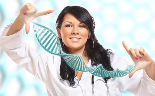 Girl stretches hands a model of a DNA molecule
