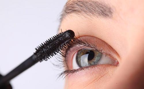 Girl holds a black brush