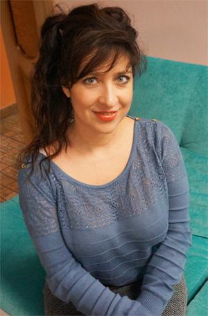 Veronica girl on a turquoise sofa