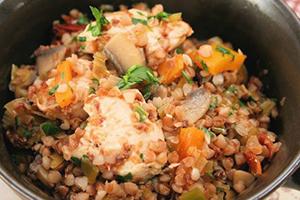 Appetizing porridge with chicken and herbs is ready to be served