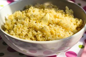 Just porridge from bulgur in a white bowl