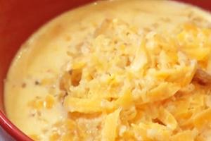 Sun porridge with pumpkin in a red bowl