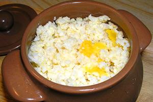 Milk porridge with butter in a clay pot