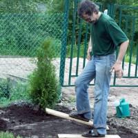 A man tramples the ground with special boots with boards
