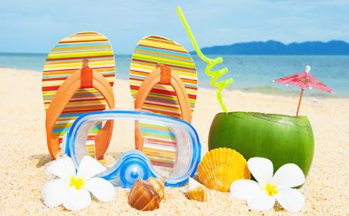 Beach, sand, slippers and coconut juice in coconut