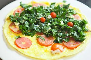 Omelet with tomatoes, cheese and herbs