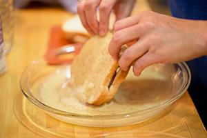 Carefully soak the future crouton in the egg-milk mixture