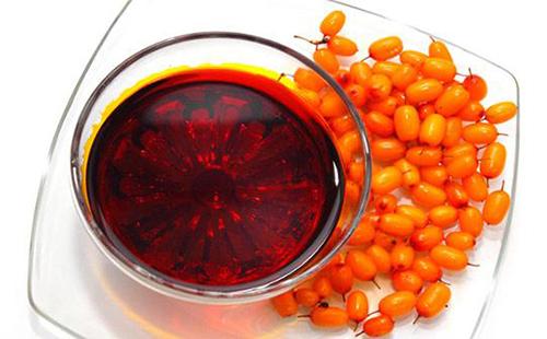 Orange sea buckthorn berries decorate a mixture of berries and Dimexidum