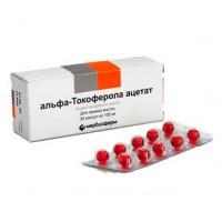 Vitamin E oil solution in red capsules