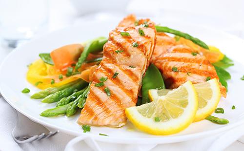 Diet fish with lemon and asparagus