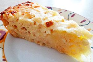 Charlotte without flour with apples on a white plate