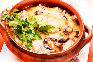 Dumplings in a pot with mushrooms
