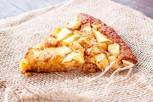 A piece of charlotte with caramelized apples