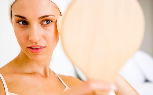 Girl looking in the mirror