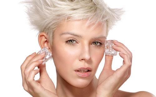 Girl holds ice in hands