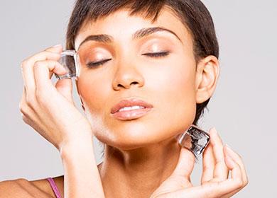 Girl wipes her face with ice