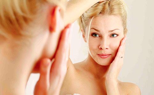 Girl looking in the mirror