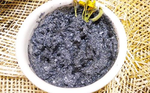 Mask of coal in a white bowl