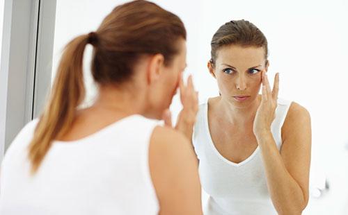 Girl looking in the mirror