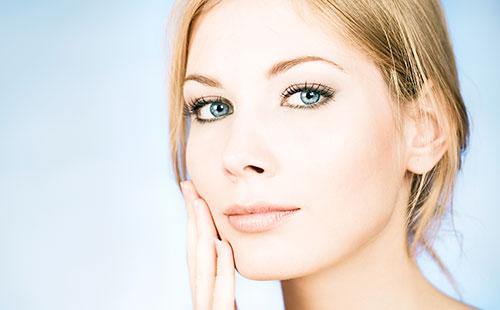 Beautiful girl touches her face