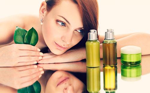 Girl looks at oil bottles