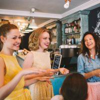 Three girls are laughing, because everything goes according to plan