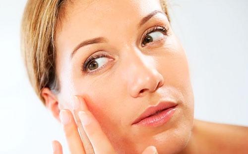 Girl looks at her reflection