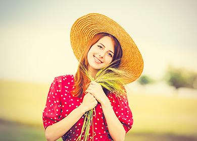 Girl with spikelets of wheat