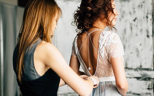 Trying on a white lace dress