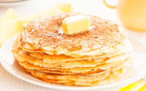 A piece of butter on pancakes