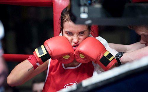 Boxer sits in the corner of the ring
