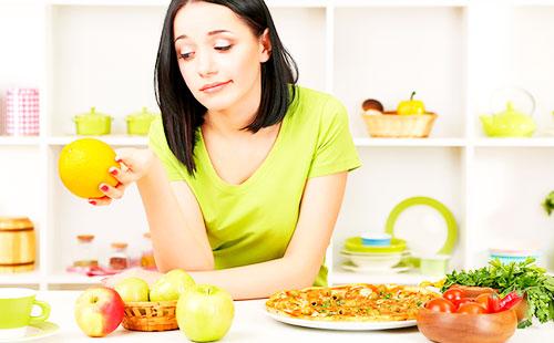 Girl holding an orange